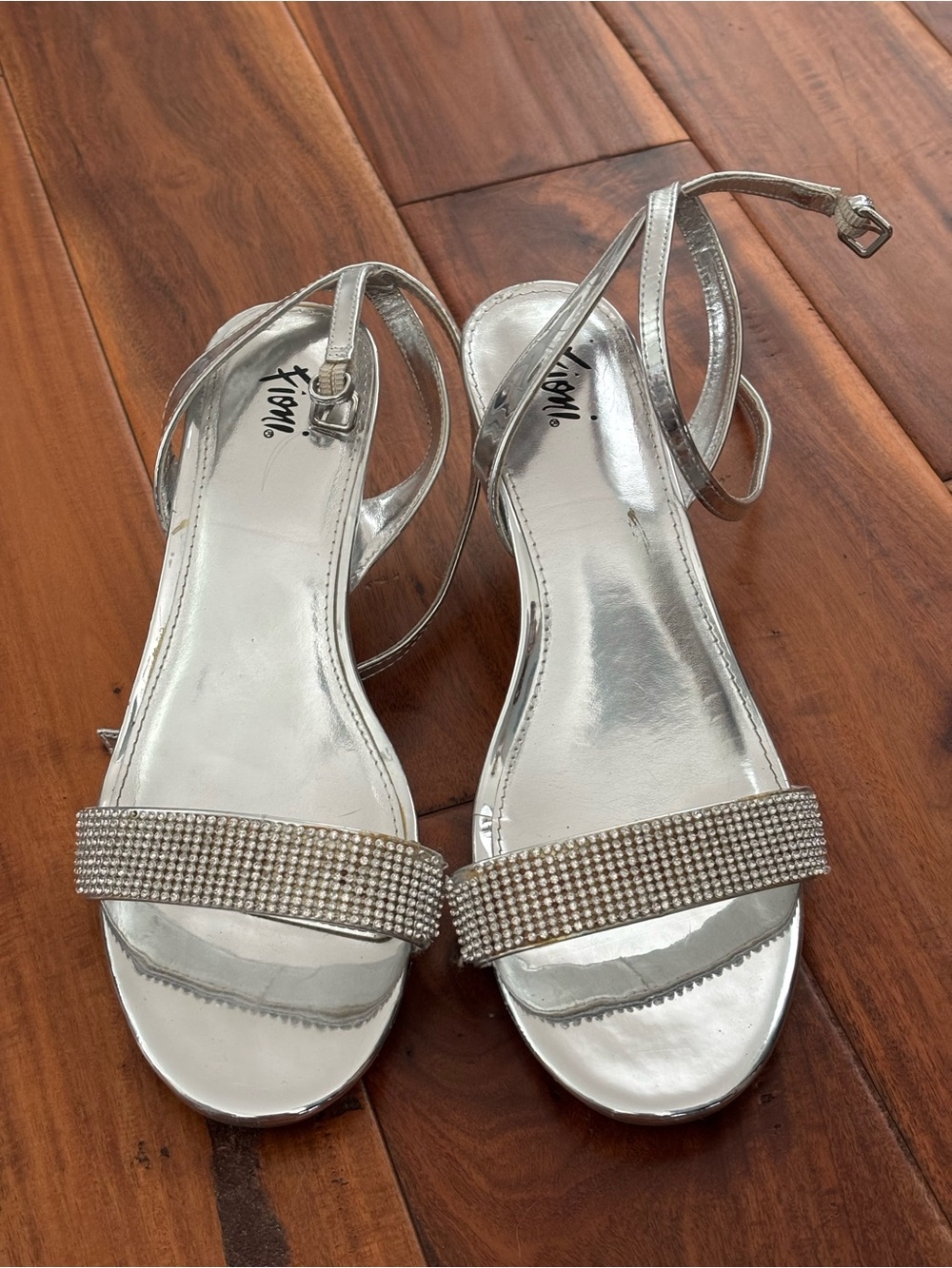 silver kitten heels with rhinestone details